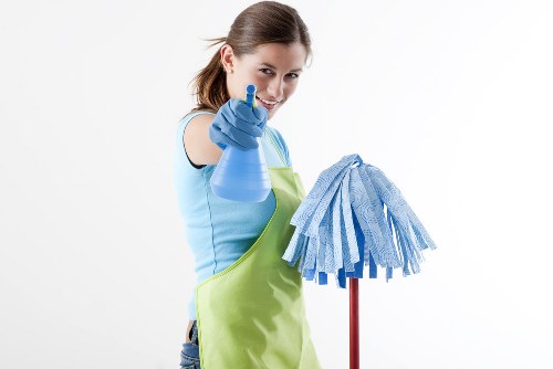 Cleaning technician preparing carpet cleaning equipment before service begins