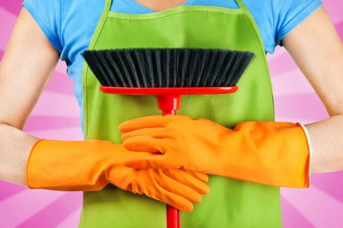 Professional cleaning team preparing domestic and commercial spaces in SW20