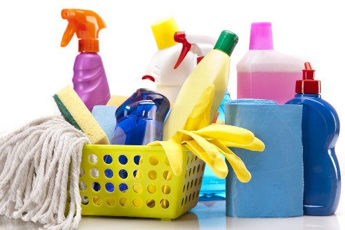 Professional carpet cleaner working in a SW20 family home